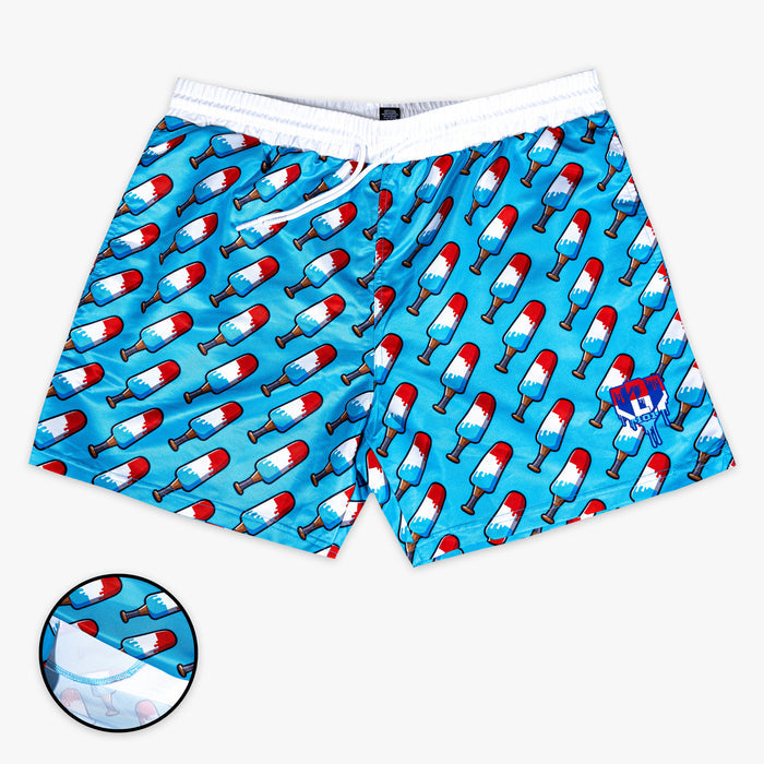 Blue shorts with red,  blue and white popsicle print on a white background