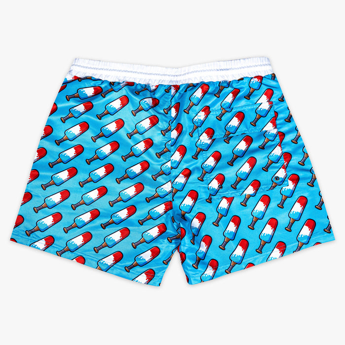 Blue shorts with red,  blue and white popsicle print on a white background