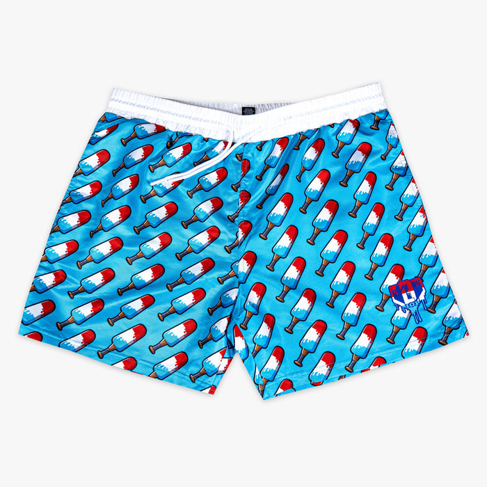 Blue shorts with red,  blue and white popsicle print on a white background