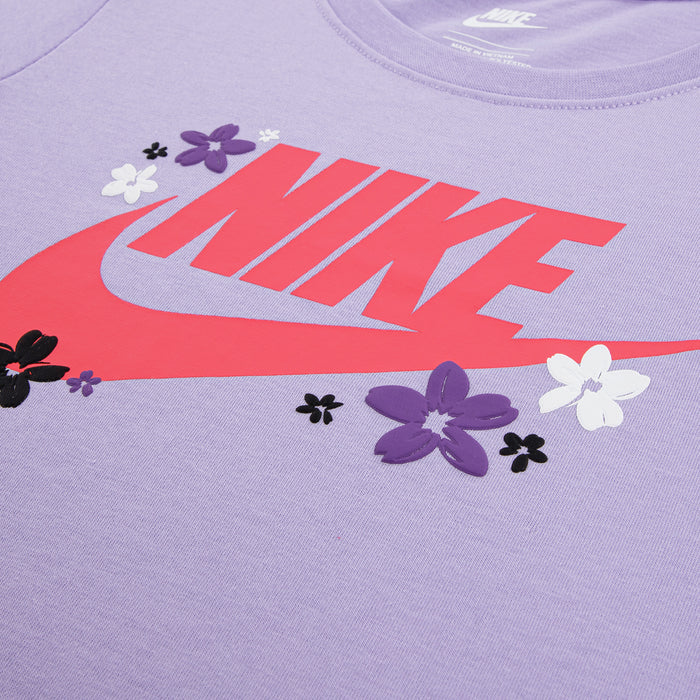 Kids lavender T-shirt close-up: pink Nike print with purple and white flowers