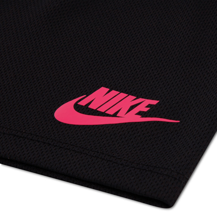 Black mesh shorts close-up: pink Nike logo on textured fabric