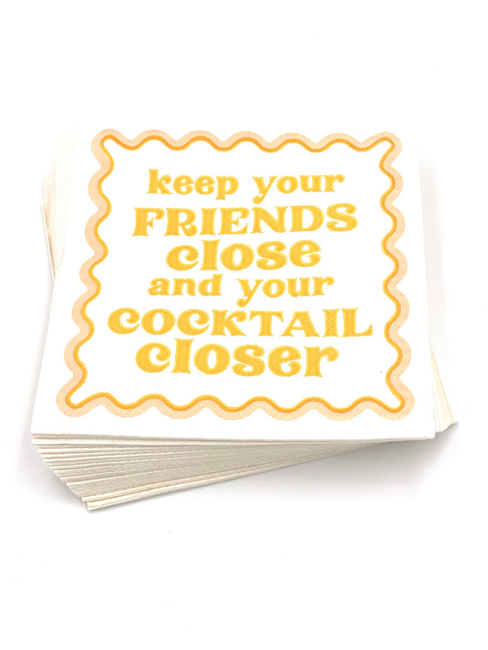 Set of 20 funny cocktail napkins by soiree-sisters featuring humorous "Keep Your Friends Close" design, ideal for parties.