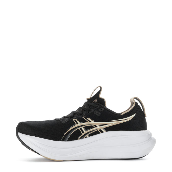 Women’s black running sneaker with gold side stripes, laces, and white platform sole