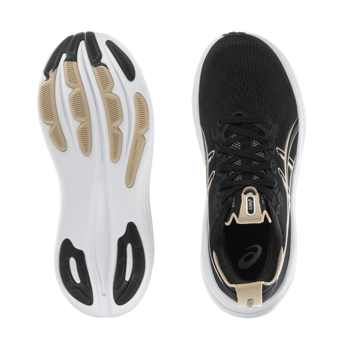 Women’s black sneaker outsole with tread pods and white midfoot with beige accents