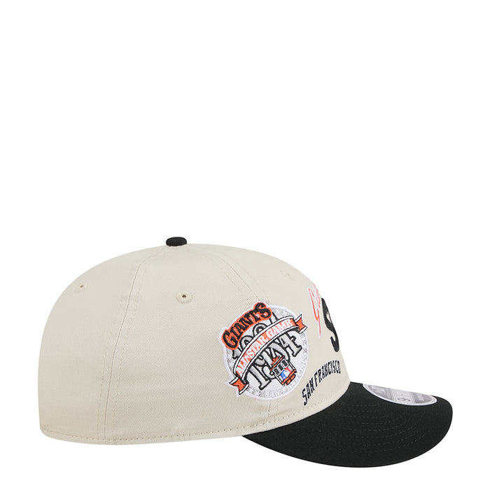 Two-tone baseball cap with cream crown and black brim, Giants patch on side