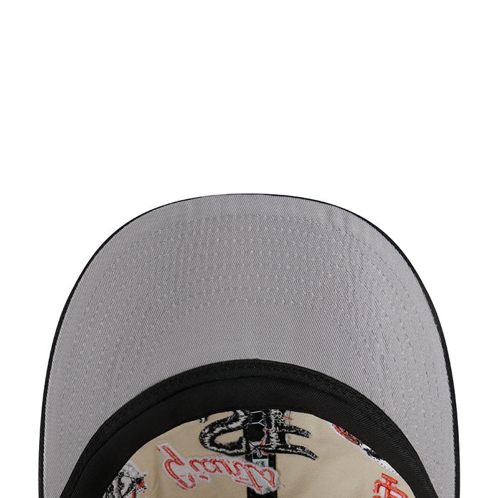 Two-tone baseball cap top view, grey crown with black brim trim and logo patch