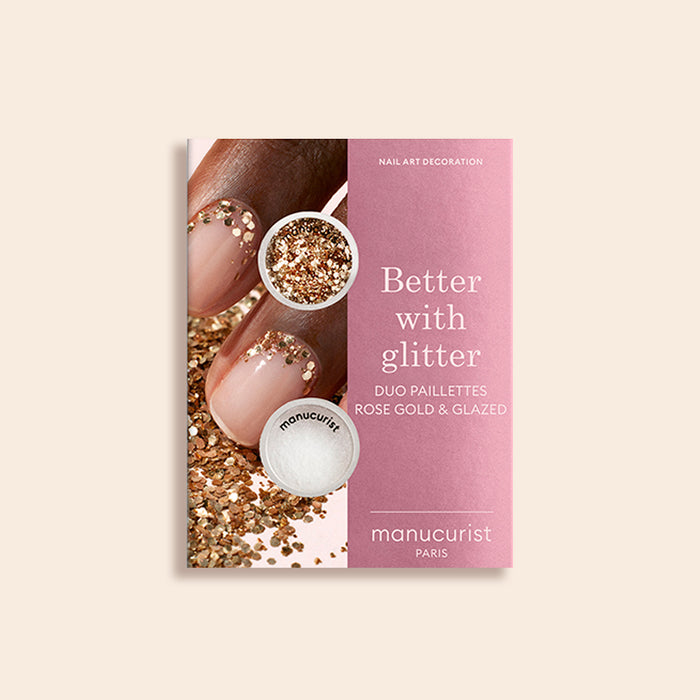 A pink and beige package from Manucurist showcases manicured nails with Glitters Duo Rose Gold  Glazed, blending rose gold glitter and white glazed effect for a pearlescent shine.