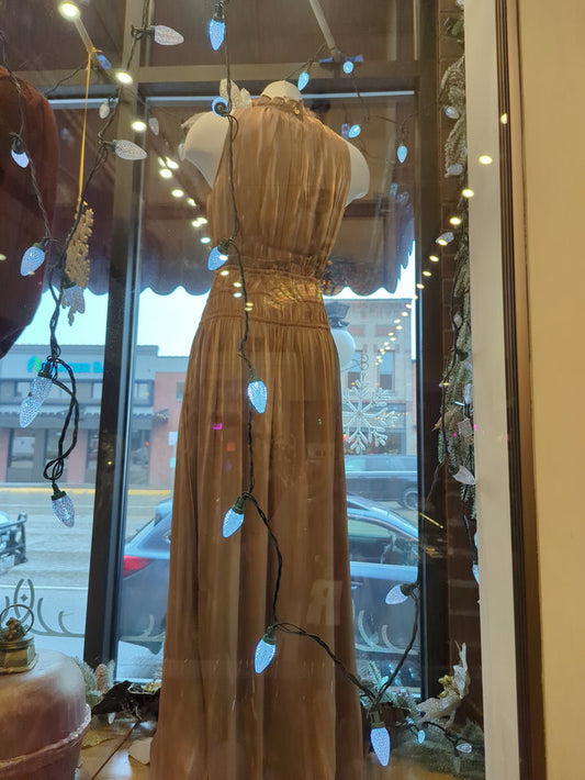 Golden silk halter dress by Current Air, featuring a flowing design and elegant neckline, perfect for formal occasions.