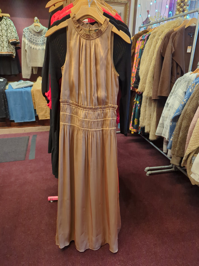 Golden silk halter dress by Current Air featuring a flowing design and elegant draping, perfect for formal occasions.