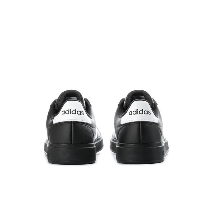 Men's black sneakers with white heel patch and visible midsole seams