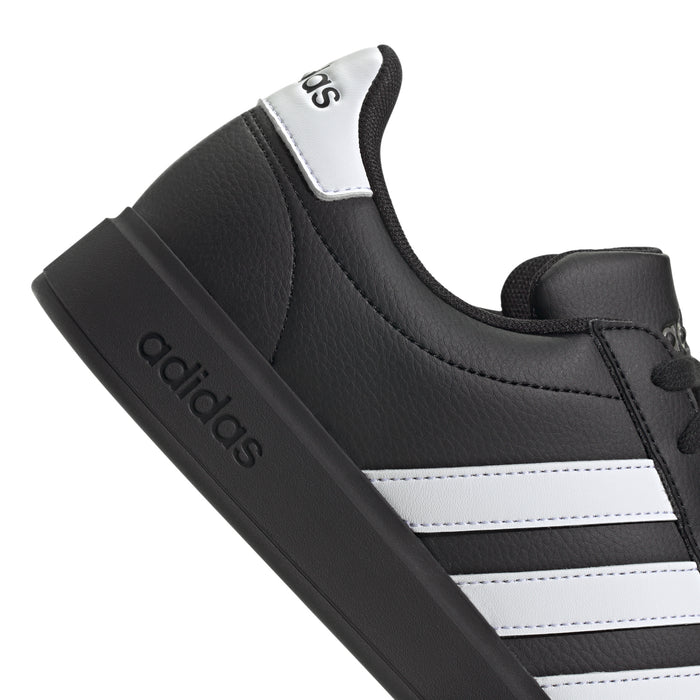 Black upper with white side stripes and adidas logo on the heel