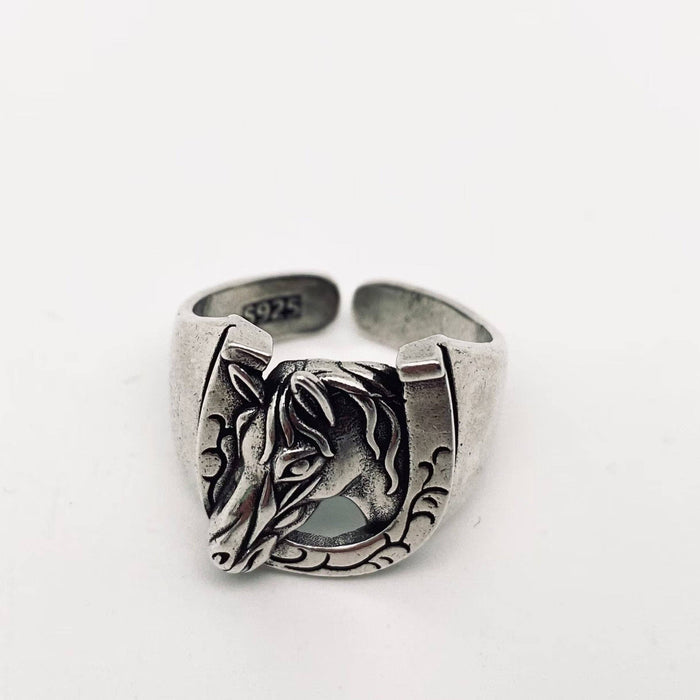 Mio Queena horseshoe horse head ring made of silver, detailed design with a horseshoe and horse head motif, jewelry accessory