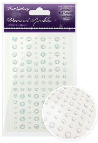This stunning selection of brand new gemstones from Hunkydory Crafts is the perfect essential addition to your craft stash! The brand new packs include 3 different sizes – 3mm, 5mm and 7mm and include a range of colours. Available at Embellish Away located in Bowmanville Ontario Canada. Aurora Borealis