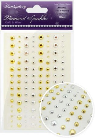 This stunning selection of brand new gemstones from Hunkydory Crafts is the perfect essential addition to your craft stash! The brand new packs include 3 different sizes – 3mm, 5mm and 7mm and include a range of colours. Available at Embellish Away located in Bowmanville Ontario Canada. Gold and Silver