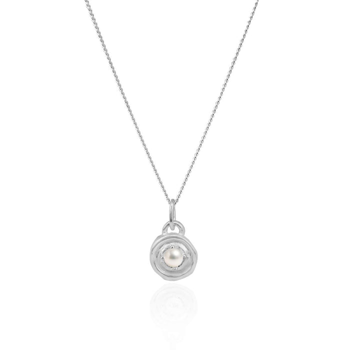 Silver necklace with a circular pendant featuring a pearl on a white background
