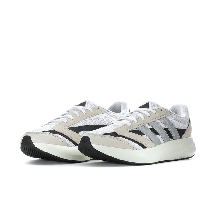 Women's low-top sneakers in white with beige overlays and black striped side panels