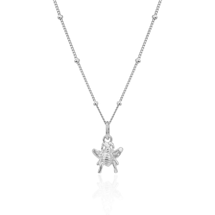Silver bee pendant necklace on a white background