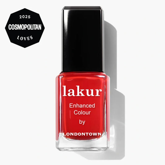 A bottle of LONDONTOWN Lakur Enhanced Colour nail polish in the bright red shade "Londoner Love," featuring a cruelty-free formula and displaying a 2025 Cosmopolitan Loves award badge in the corner.