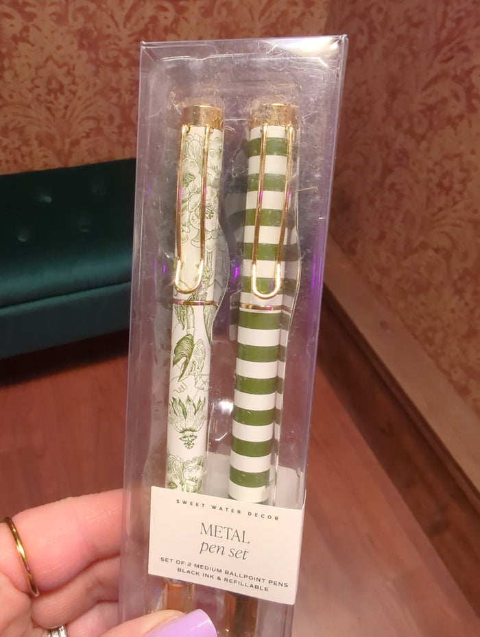 Set of four sleek metal pens from Sweet Water Decor, featuring modern design and smooth writing tips.