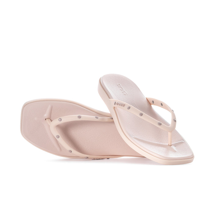 Women's light pink flip-flops showing thong strap and cushioned sole