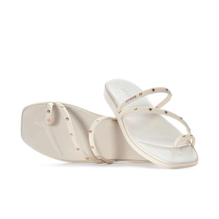 Women’s toe-loop sandals shown side-by-side with studded straps and light upper