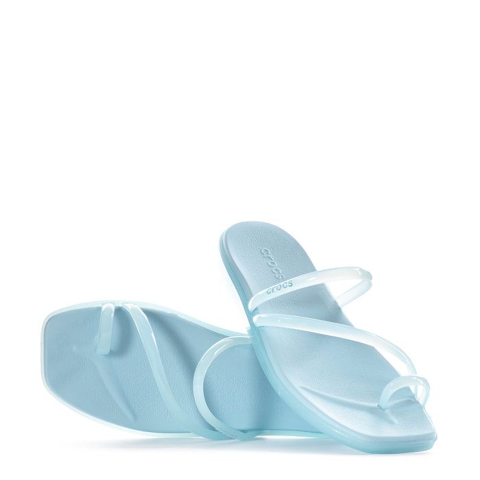 Sky blue toe-loop slide sandals shown with Crocs logo on the footbed
