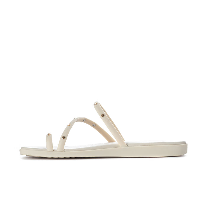 Women’s studded toe-loop sandals, side view with three light straps and sole
