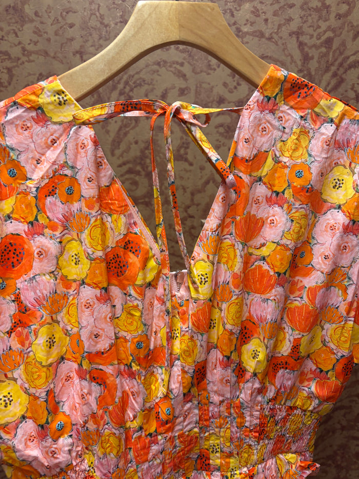 Entro Poppies Dress featuring a floral pattern, sleeveless design, and lightweight fabric for a stylish and comfortable look.