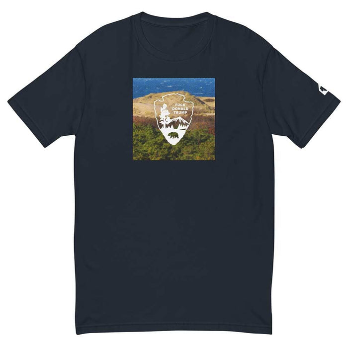 Navy blue t-shirt with a graphic of a a dunes landscape and logo on a white background