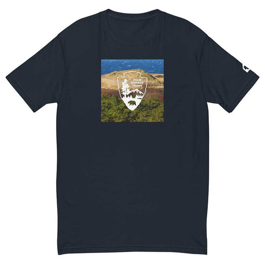 Navy blue t-shirt with a graphic of a a dunes landscape and logo on a white background