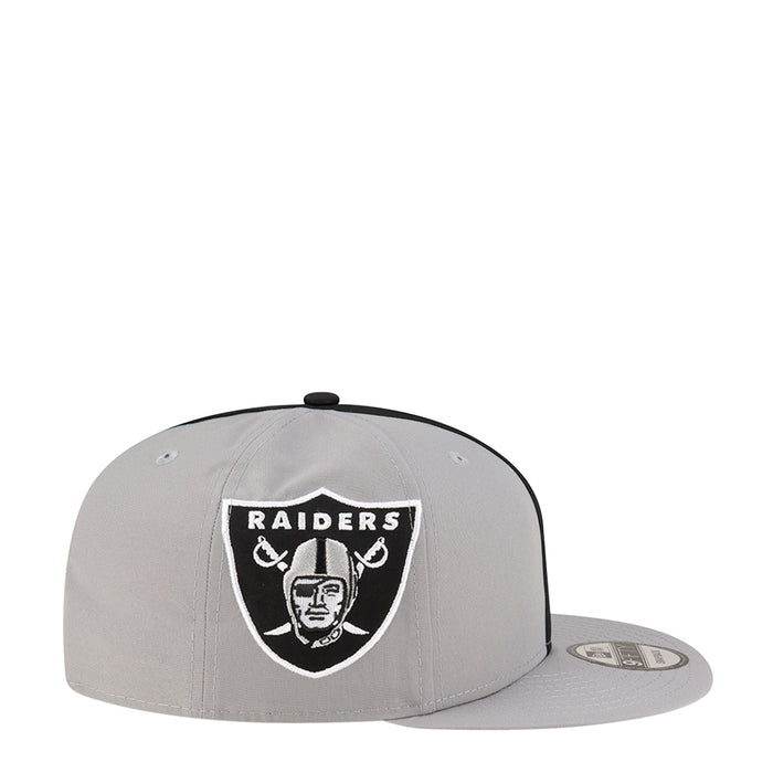 Light grey snapback cap with Raiders shield logo on front