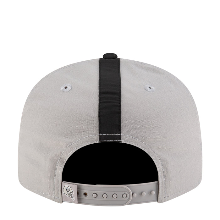Light grey snapback cap showing adjustable back strap