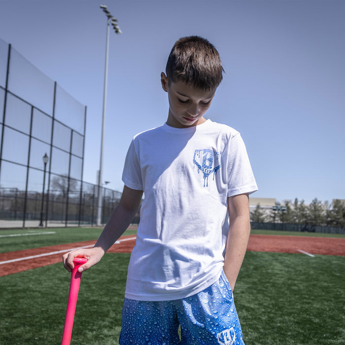Youth model wearing white Rain Delay youth graphic tee
