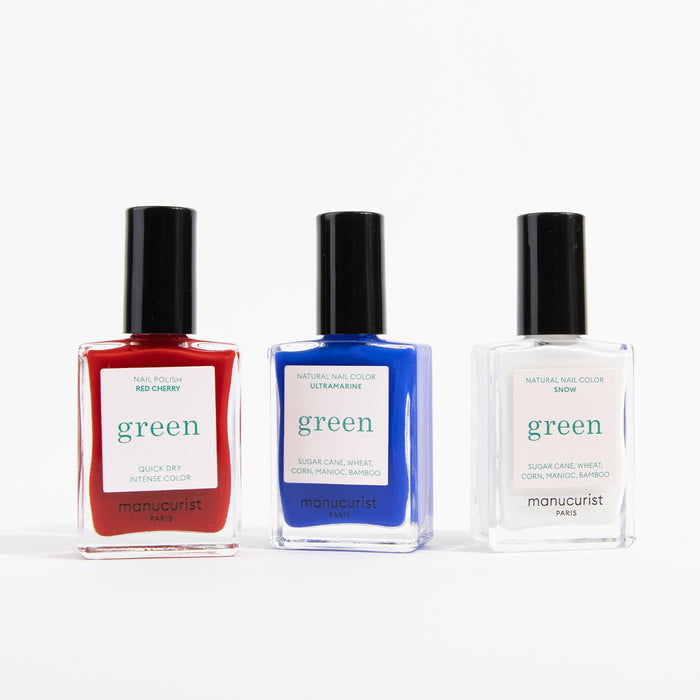 The Manucurist Red, White  Blue Trio features three natural nail polishes—Red Cherry, Ultramarine, and Snow—inspired by bold red, white, and blue eyeshadow for intense color and quick dry.