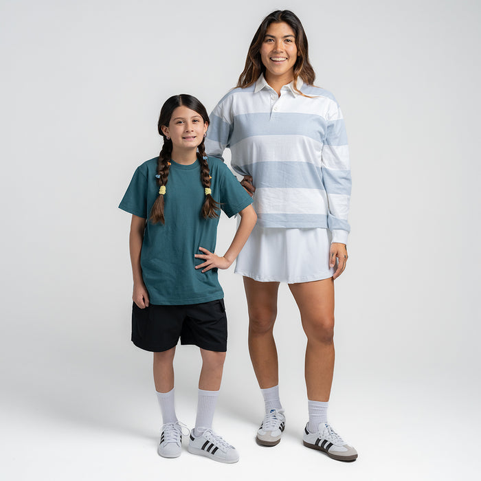 Womens rugby polo shirt on model, white and light-blue wide stripes, collared