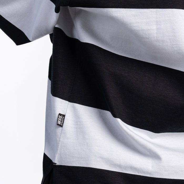 Close-up: black and white striped rugby polo fabric with small side label