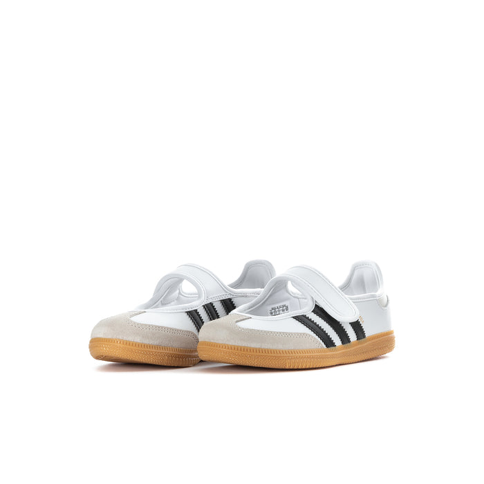 Kids white sneakers pair view with black stripes and gum rubber outsoles
