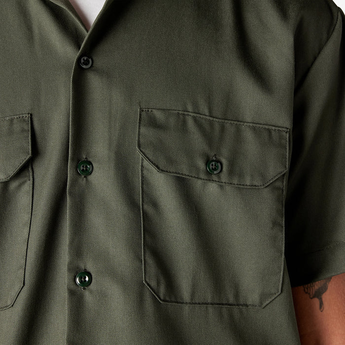 Olive green work shirt close-up showing chest pockets and button front