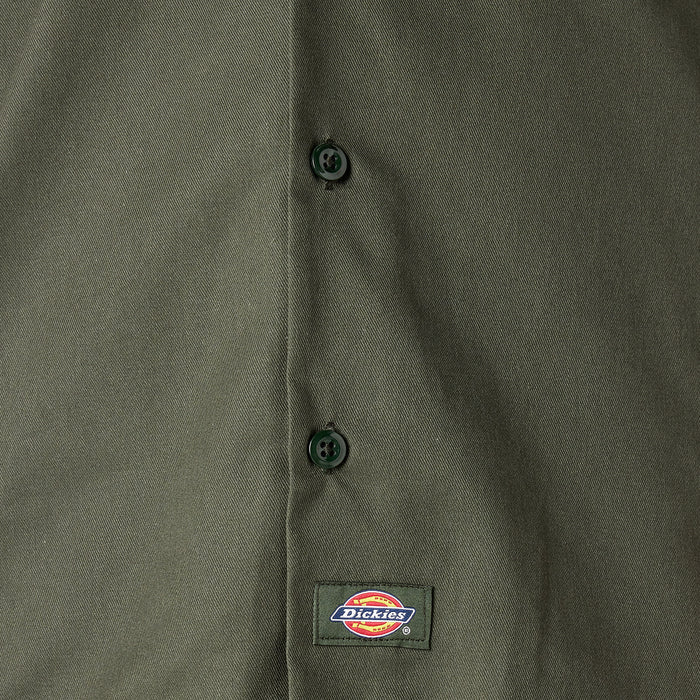 Olive green work shirt close-up with buttons and Dickies label at chest