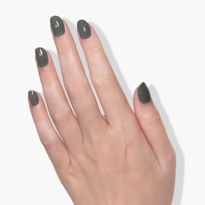 The product, Star Moss by LONDONTOWN, is showcased on a hand with olive-shaded nail polish against a white background.