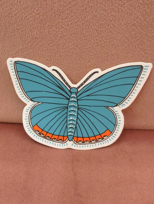 Blue butterfly sticker featuring lupine flowers by Field Guide Designs, with vibrant colors and detailed floral and butterfly design.
