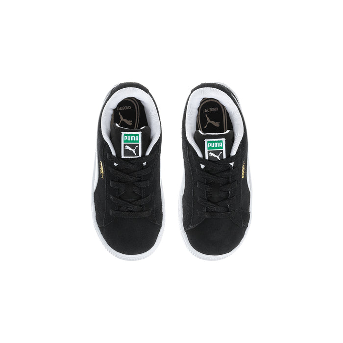 Toddler black suede sneakers, inside tongue showing PUMA label and eyelets