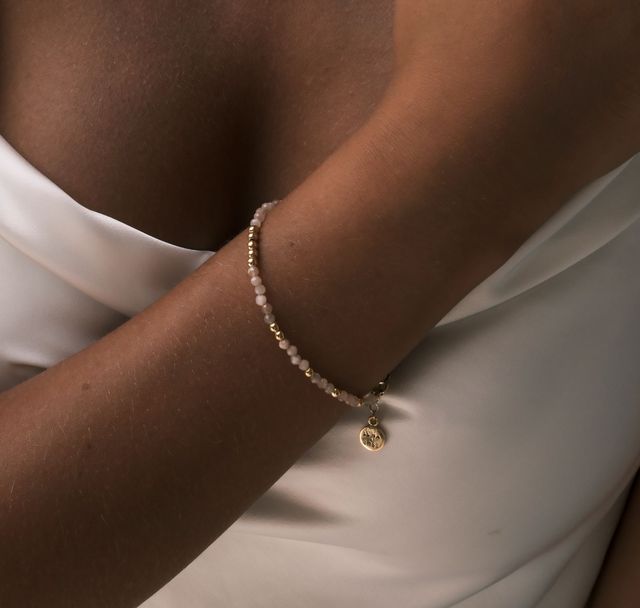 a woman wearing The Billy Blush Bracelet Gold by Luna and Rose Bali