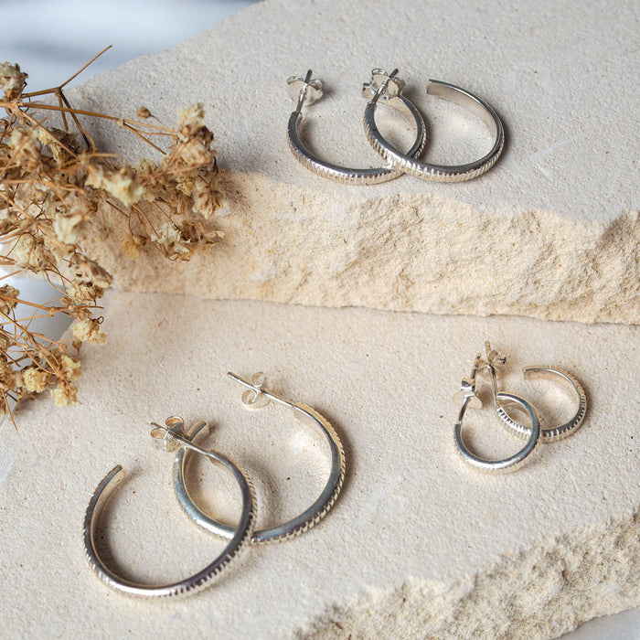 three different sizes of The Met stripe thin band hoops earrings