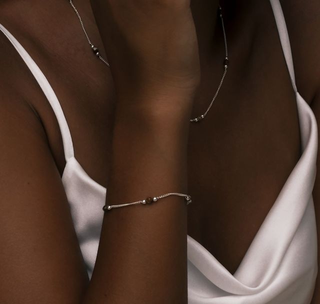 a woman wearing The Sunstone Bracelet Silver  by Luna and Rose Bali