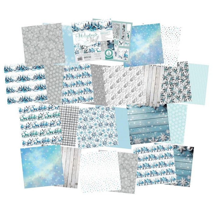 Tonic Studios - Art Pad 8"X8" - Winter's Veil. This winter wonderland blue, silvery grey and white creates a serene holiday background. Includes 36 luxury sheets (3 of each double sided); acid and linen free. Available at Embellish Away located in Bowmanville Ontario Canada.