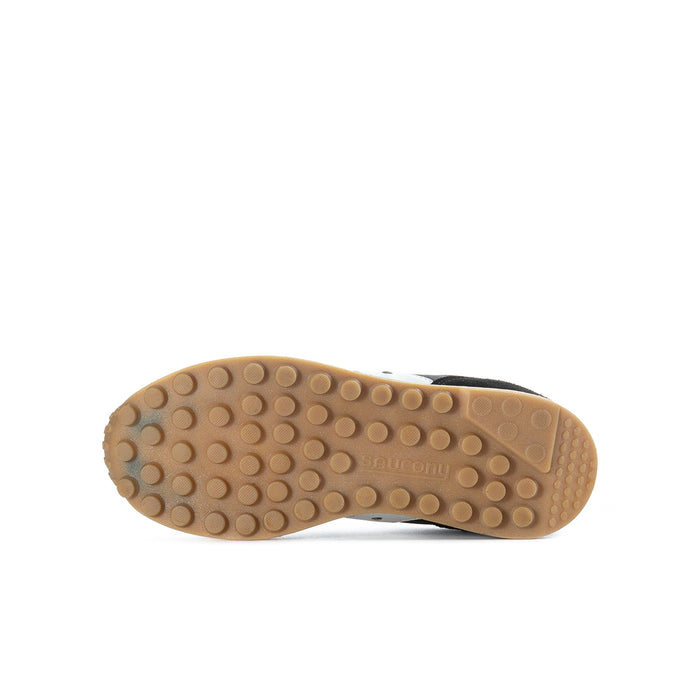 Youth black sneaker outsole with circular traction tread, tan rubber