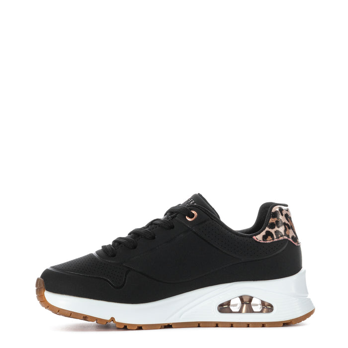 Kids black low-top sneaker side view with leopard collar and rose-gold charm chain detail