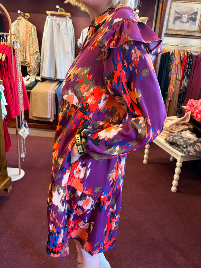 Anniewear V-neck tiered mini dress with flowy fabric and sleeveless design, perfect for casual or summer wear.