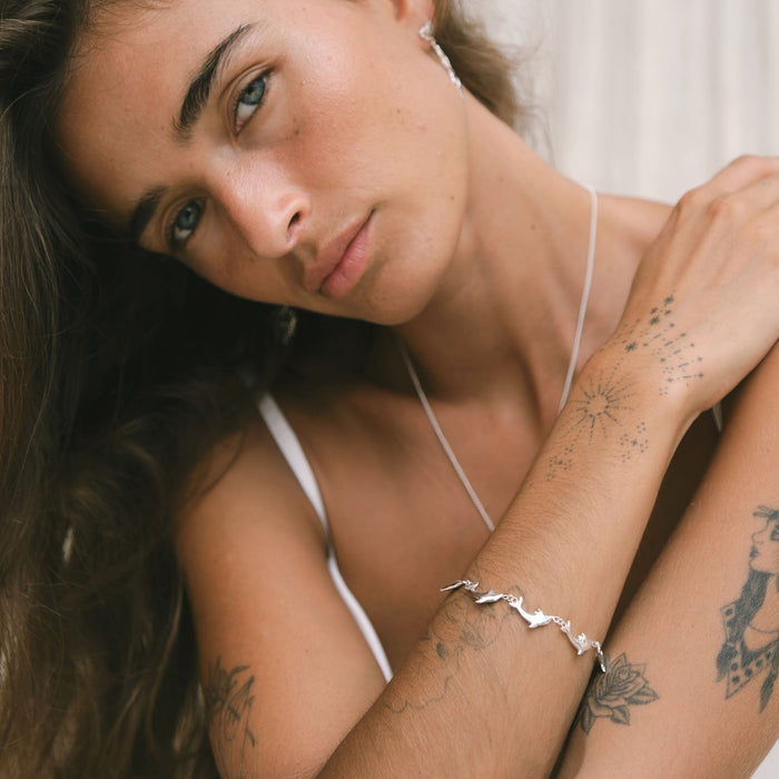 Handmade Luna & Rose x Tahnee Kelland ‘Vibes Don’t Lie’ silver bracelet, dolphin design symbolising flow, crafted sustainably in Bali style.